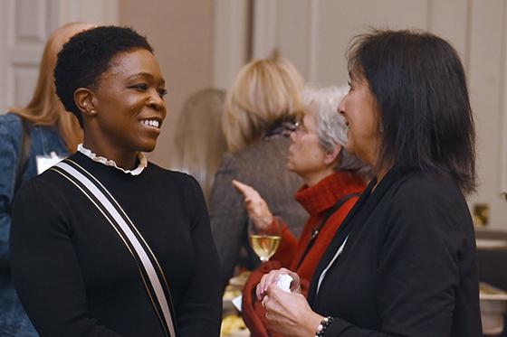 Photo of two women speaking at a networking event at Chatham University